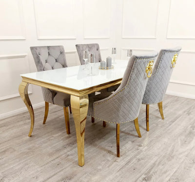 Louis gold white glass dining table with grey Bentley chairs