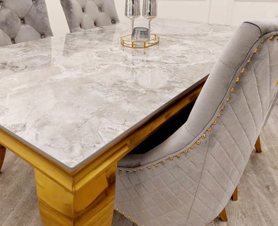 Louis gold sintered stone dining table with grey Bentley chairs