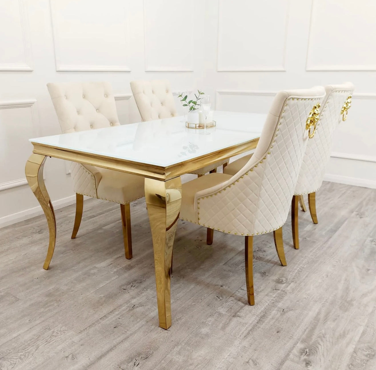 Louis gold white glass dining table with cream Bentley chairs