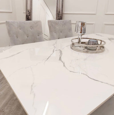 Alaska sintered stone chrome dining table with Mayfair lion chairs