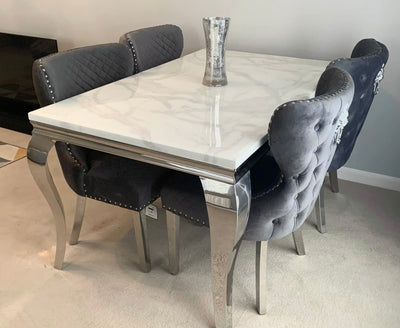 Louis white marble dining table with Sophia lion knocker chairs